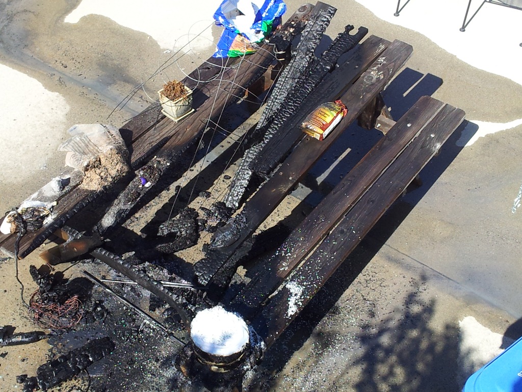 burned picnic table